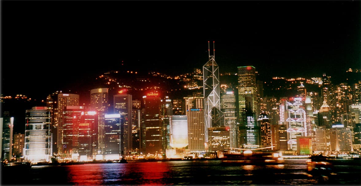 Hong Kong skyline across Victoria Harbour at dusk
