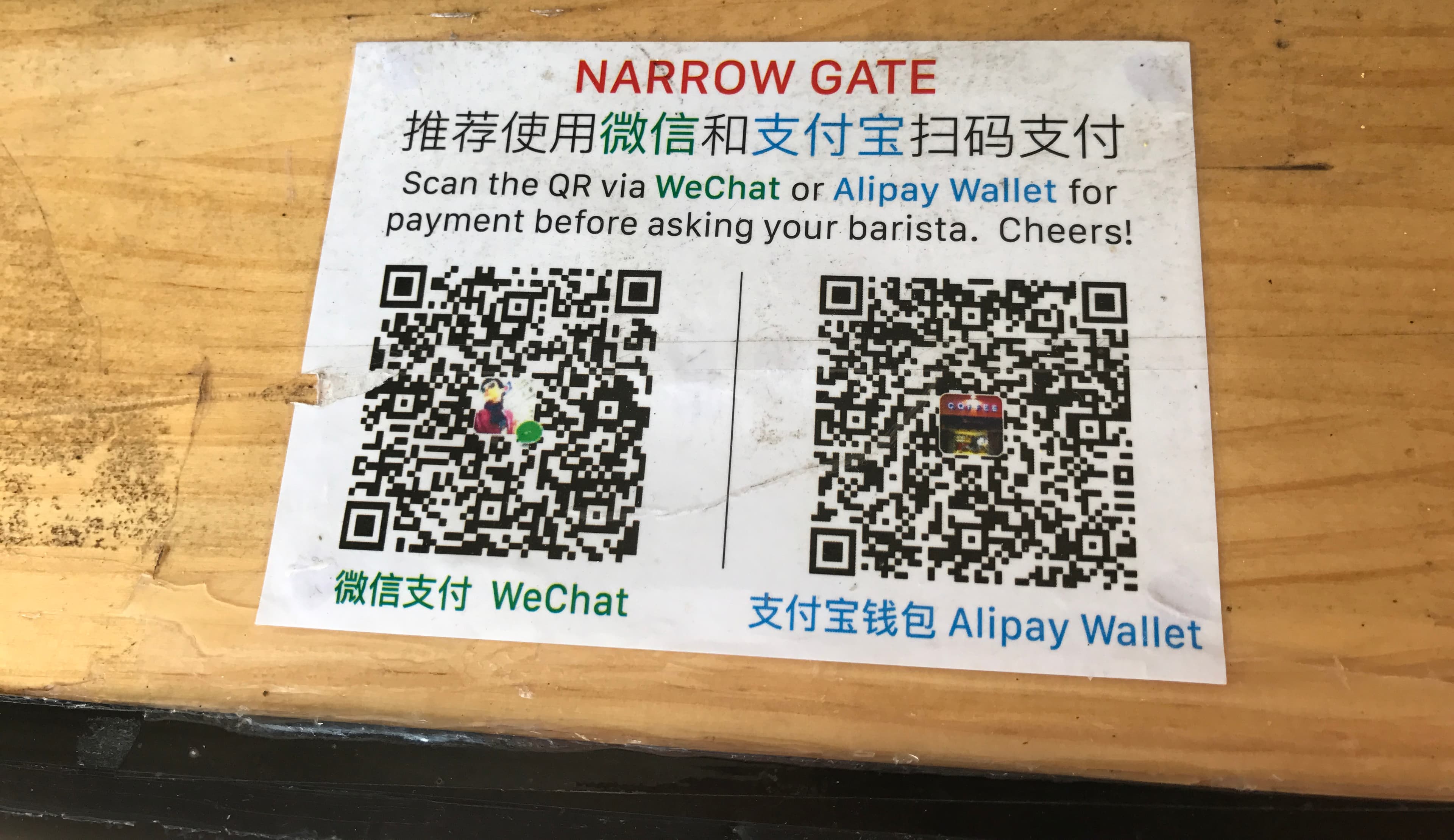 Mobile payment QR placards for app setup and checkout readiness