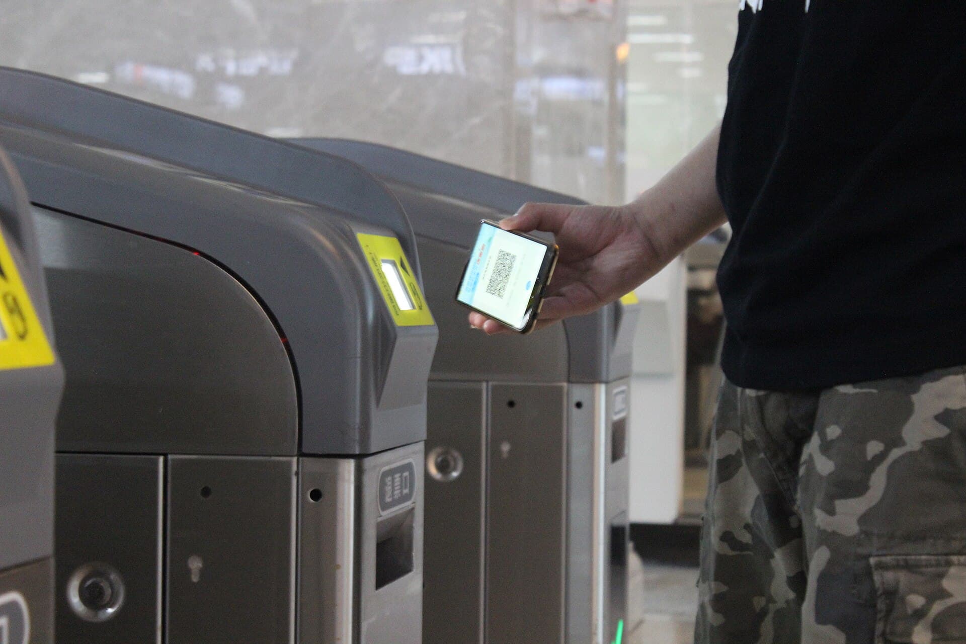 Passengers scanning QR codes at metro gates in Wuhan.